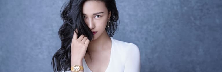 Chen Man matches rose gold diamond earrings with a luxury watch