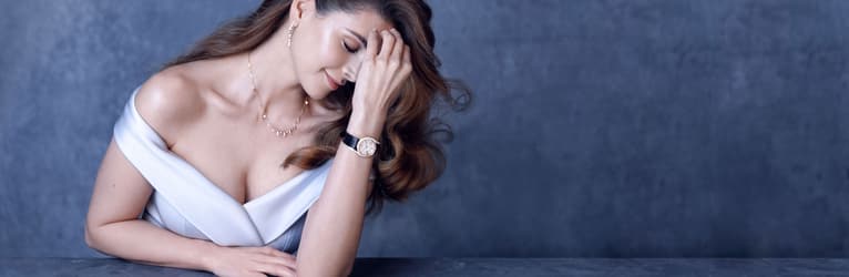 Shiva Safai wearing a gold diamond watch with a rose gold diamond necklace
