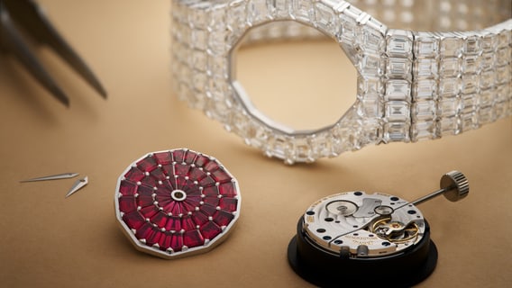 Assembly of a gold and diamond watch