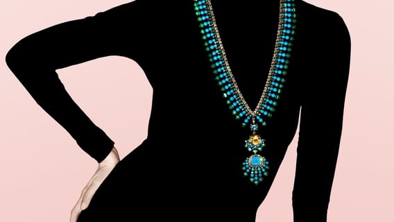 gold long necklace adorned with precious and semi-precious stones