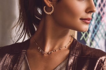 gold necklace and gold earrings