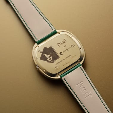 automatic yellow gold onyx watch viewed from the back