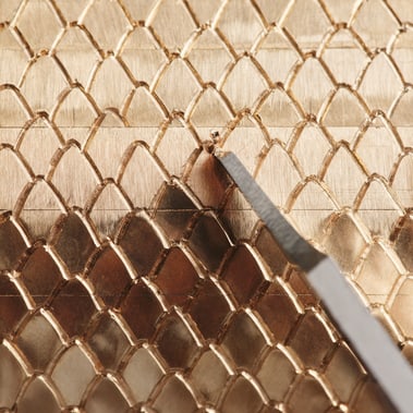 yellow gold texture engraved with a scale pattern