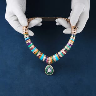 Piaget necklace in gold adorned with gemstones and semi-precious stones